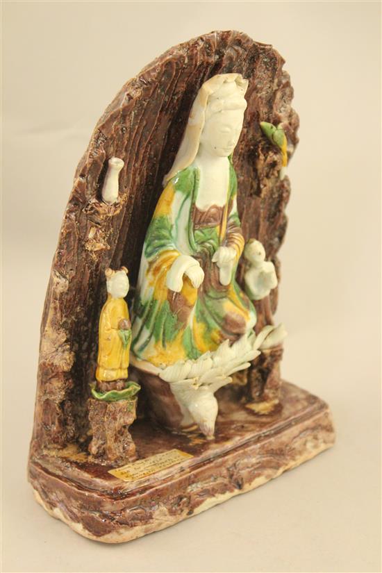A Chinese Sancai glazed biscuit shrine of Guanyin, Kangxi period, 20.5cm